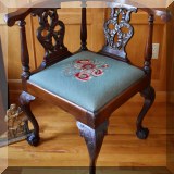 F35. Carved corner chair with needlepoint seat. 